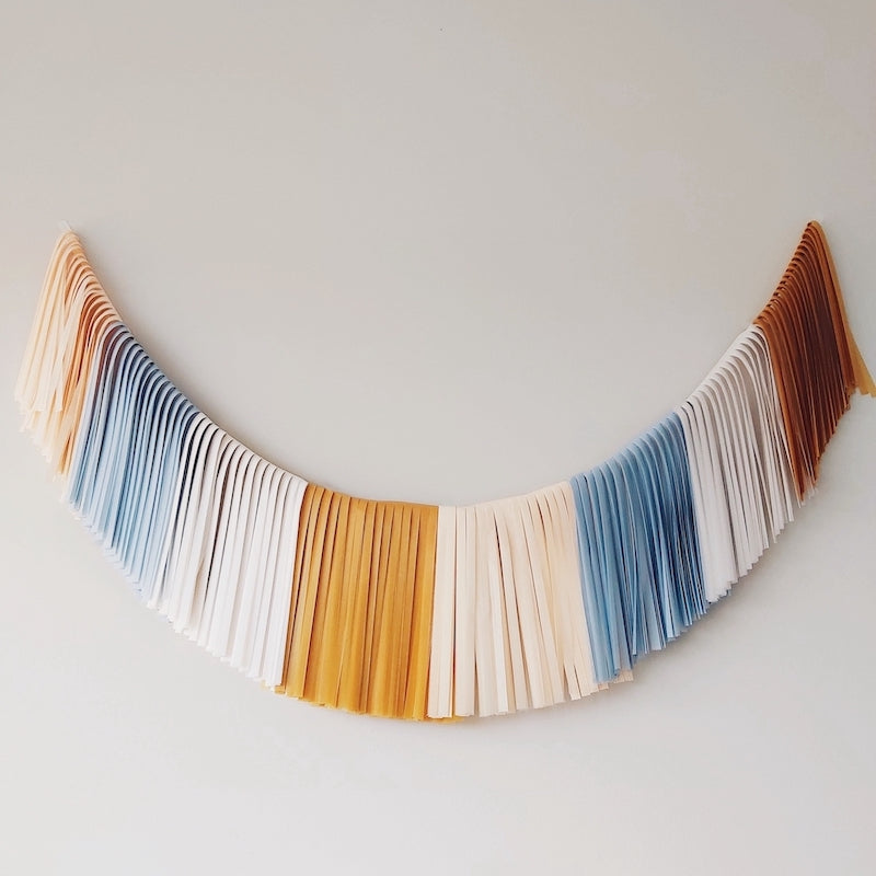 Guirnalda de flecos azul/mostaza