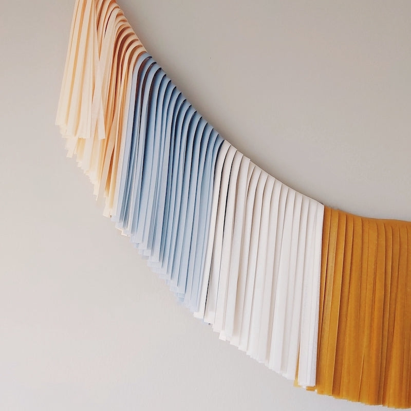 Guirnalda de flecos azul/mostaza